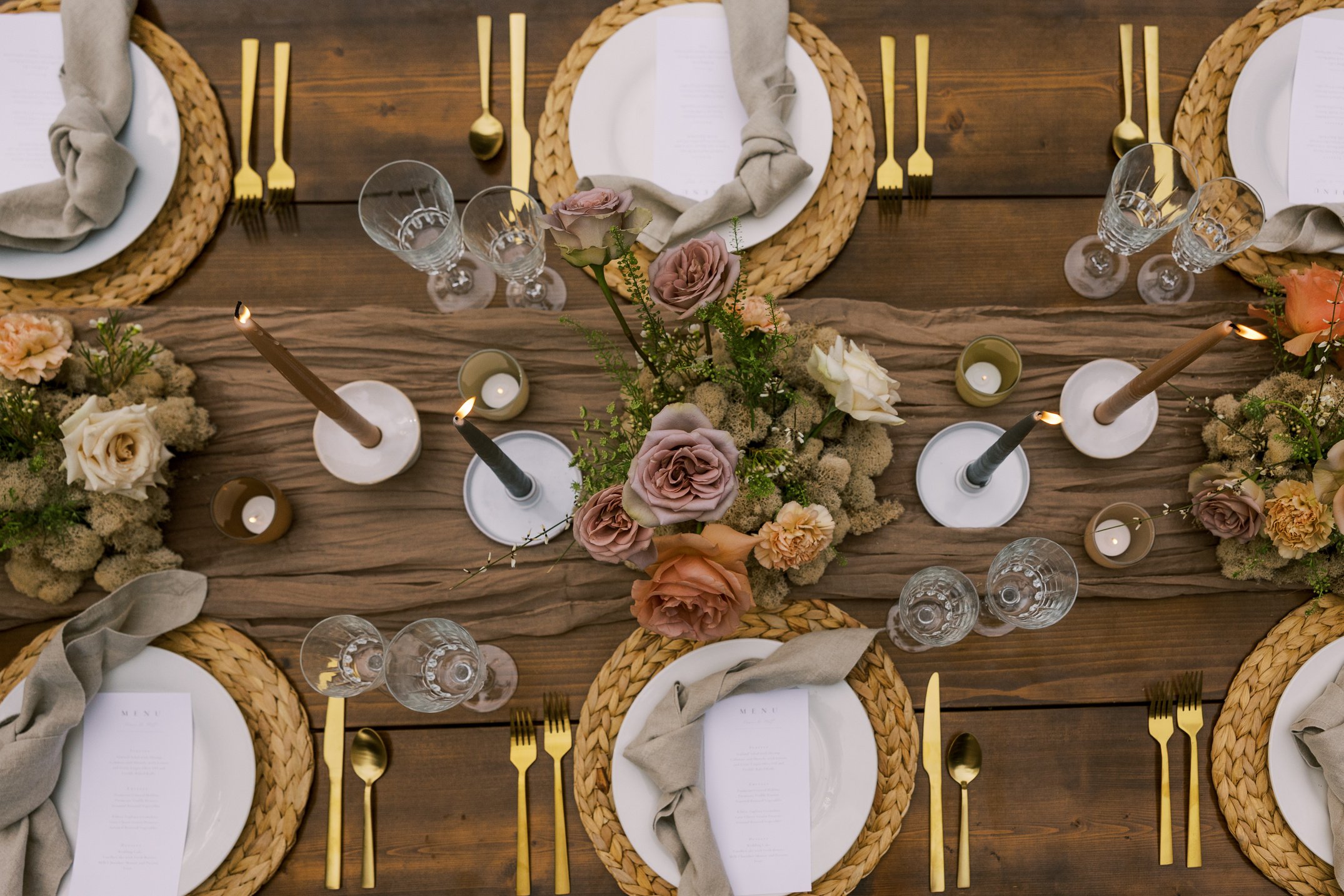 Top View of Elegant Table Setting with Candles and Flowers